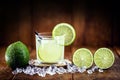 Caipirinha cocktail in glass on wooden table background. Copyspace, bar menu image, national caipirinha day, 13th September