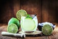 Caipirinha cocktail in glass on wooden table background. Copyspace, international caipirinha day, 13th September Royalty Free Stock Photo