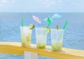 Caipirinha drink in boat support with a blue sea background on a beautiful sunny day Royalty Free Stock Photo