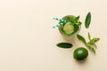 Caipirinha, Mojito cocktail, vodka or soda drink with lime, mint and straw on table background. Refreshing beverage with Royalty Free Stock Photo