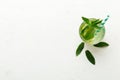 Caipirinha, Mojito cocktail, vodka or soda drink with lime, mint and straw on table background. Refreshing beverage with Royalty Free Stock Photo