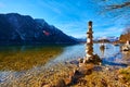 A cairn  human-made pile or stack of stones near Hallstatt lake at sunny day in Austrian Alps Royalty Free Stock Photo