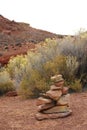 Cairn, pile of stones in red desert