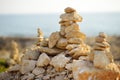 Cairn of stones in desert hills on Cyprus. Pyramid of rocks marking the trail for hiking Royalty Free Stock Photo