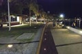 Cairns, Australia - August 22, 2009: Tourists and locals at night along the city promenade