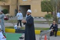 A mosque preacher Imam performs Eid Al Fetr Khutbah (sermon) in an open air space near the mosque,