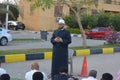 A mosque preacher Imam performs Eid Al Fetr Khutbah (sermon) in an open air space near the mosque,