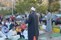 A mosque preacher Imam performs Eid Al Fetr Khutbah (sermon) in an open air space near the mosque,