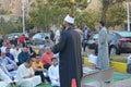 A mosque preacher Imam performs Eid Al Fetr Khutbah (sermon) in an open air space near the mosque,