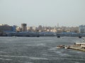 Cairo, Egypt, April 16 2023: The river Nile of Egypt with modern buildings and bridges along the Nile bank and the Egyptian walk Royalty Free Stock Photo