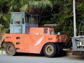 Wheeled Asphalt compactor paver truck, A paver (road paver finisher, asphalt finisher, road paving Royalty Free Stock Photo