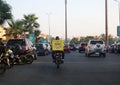 Cairo, Egypt, August 22 2023: Noon motorcycle delivery service on the road for shipping an online purchased package, Noon is a
