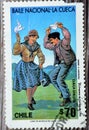 Old used postage stamp printed in Chile features the national Chilean dance of The Cueca Royalty Free Stock Photo
