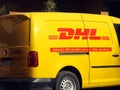 Cairo, Egypt, December 7 2022: DHL truck delivering a package, DHL is the global leader in the logistics industry specializing in