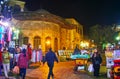 CAIRO, EGYPT - DECEMBER 21, 2017: The evening shopping in Al Muizz street of busy market, the medieval sabil-kuttab of Tusun Pasha Royalty Free Stock Photo