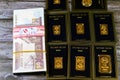 Cairo, Egypt, December 8 2023: 24K karat BTC Bullion Trading Center pure yellow gold of bars and sovereign coin, and a stack of