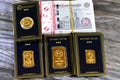 Cairo, Egypt, December 8 2023: 24K karat BTC Bullion Trading Center pure yellow gold of bars and sovereign coin, and a stack of Royalty Free Stock Photo