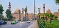 CAIRO, EGYPT - DECEMBER 21, 2017: The pleasant walk along Salah El Deen Square with a view on green garden, fast traffic and