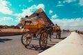 Cairo Egypt December 2021 Rear view of a horse chariot riding around the great pyramids of giza. Popular way of getting around the