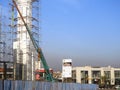 Cairo, Egypt, January 20 2024: A construction site of a new mosque with a steel structure of the dome and scaffolds all along the