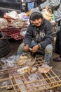 CAIRO, EGYPT - JANUARY 27, 2019: Local boy eating a bread and fuul on a street in Cairo, Egy Royalty Free Stock Photo