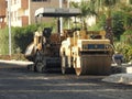 Cairo, Egypt, July 19 2023: Asphalt paver trucks and compactors, A paver (road paver finisher, asphalt finisher, road paving Royalty Free Stock Photo