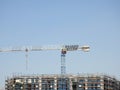 Cairo, Egypt, July 21 2023: A construction site of a new industrial building with scaffoldings and cranes by Hassan Allam