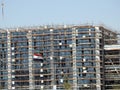 Cairo, Egypt, July 21 2023: A construction site of a new industrial building with scaffoldings and cranes by Hassan Allam