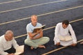 Cairo, Egypt, July 8 2022: A Noble Quran reading ring inside a mosque at the day of Arafah or Arafat before Eid Al-Adha, a group