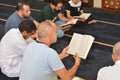 Cairo, Egypt, July 8 2022: A Noble Quran reading ring inside a mosque at the day of Arafah or Arafat before Eid Al-Adha, a group