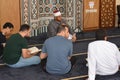 A Noble Quran reading ring inside a mosque at the day of Arafah or Arafat before Eid Al-Adha