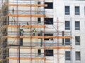A construction site of a new modern multiple levels building with scaffolds with workers as a part of Egypt real estate projects Royalty Free Stock Photo