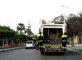 Cairo, Egypt, March 23 2023: a garbage large mobile car vehicle collecting garbage for trash removal from dustbins for