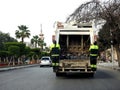 Cairo, Egypt, March 23 2023: a garbage large mobile car vehicle collecting garbage for trash removal from dustbins for