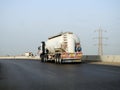 Cairo, Egypt, May 20 2023: A big truck with a container tank with petroleum products, a lorry on the highway with a container on