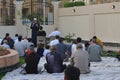 A mosque preacher Imam performs Eid Al Fitr Khutbah (sermon) in an open air space