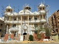 Cairo, Egypt, May 10 2023: A new residential building villa under construction with scaffoldings on the buildings for painting and