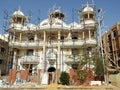 Cairo, Egypt, May 10 2023: A new residential building villa under construction with scaffoldings on the buildings for painting and