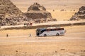 CAIRO, EGYPT - MAY 18 2021: tourist excursion bus of the tour operator Anex Tour, brought tourists to the pyramids of Giza.