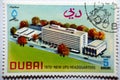 An old postage stamp printed in United Arab Emirates UAE Dubai shows Inauguration of the new headquarters of the UPU