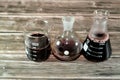 Cairo, Egypt, October 18 2022: A laboratory set of glassware of conical, boiling and volumetric flasks that contains dark red Royalty Free Stock Photo