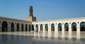 Courtyard of public historic Al Hakim Mosque known as The Enlightened Mosque with minaret, Cairo