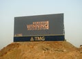 A large Advertisement LCD LED TV on a sand hill for TMG Talaat Moustafa Group, one of the largest conglomerates in Egypt Royalty Free Stock Photo