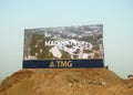 Cairo, Egypt, September 24 2022: A large Advertisement LCD LED TV on a sand hill for TMG Talaat Moustafa Group, one of the largest Royalty Free Stock Photo