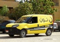 Cairo, Egypt, September 29 2023: Noon online shopping delivery yellow van to deliver a package, Arabic Translation (Noon.com