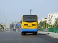 A public transport Egyptian bus on a highway, selective focus of a public transportation one level touring passengers