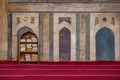 11/18/2018 Cairo, Egypt, shelf with religious books in Arabic in the middle of a great mosque