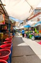 Cajamarca, Peru - September 2018: Local colorful market in Peru with people shopping food on the stalls