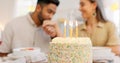 Cake, anniversary or birthday, couple celebrate and romantic together, kiss and love during dinner date. Young, man and Royalty Free Stock Photo