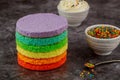 Cake assembly. layer cake with icing and sprinkles Royalty Free Stock Photo